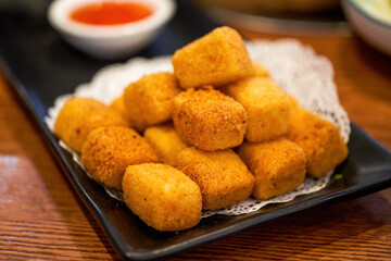 A plate of golden fried tofu