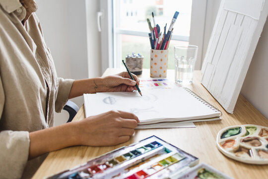 Person Sketching Studying Art At Home Art Desk