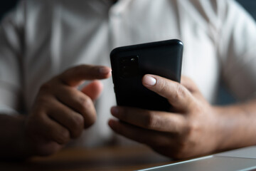 Business man holding smartphone for mobile device business concept