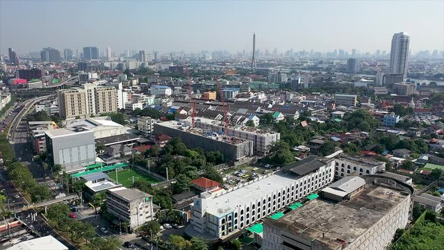 Aerial drone view of Bangkok city downtown. Asian small community with heavy traffic in the Capital of Thailand.