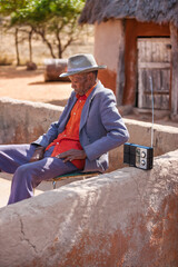old african man with a radio
