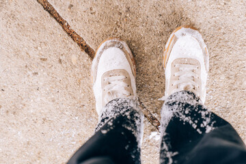Snowy winter shoes and pants with snow