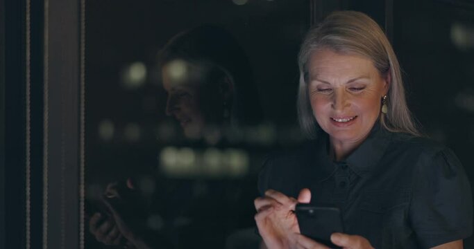 Night, smartphone and business woman networking on global app, reading funny meme or social media chat. Happy corporate employee using phone or cellphone in dark office, smile for online notification