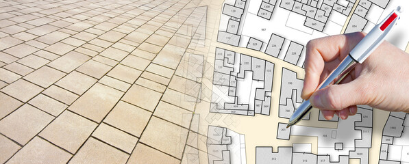 Urban street paving with modern stones in an pedestrian zone - concept with an imaginary city map