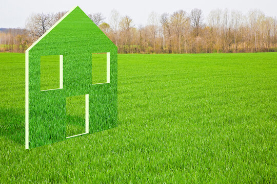 Land Plot Management - Real Estate Concept With A Vacant Land On A Green Field Available For Building Construction With A Green Home Icon