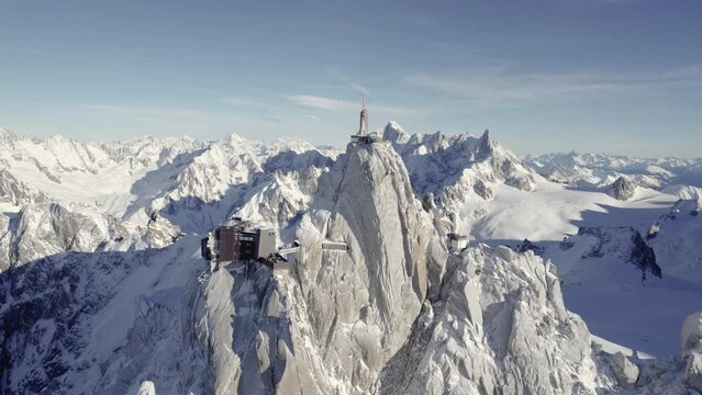 Observatory and visitor center Aiguille du Midi the Mont Blanc Mountain peak with weather station, Aerial orbit left shot