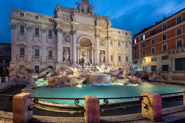 Naklejka premium Amazing panoramic view with no people of famous Rome Trevi Fountain (Fontana di Trevi) in blue hour before sunrise, Rome, Italy.