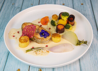 Recipe of cod steak, mashed potatoes and its farandole of vegetables, parsnip, turnip, broccoli, candied potato. High quality photo