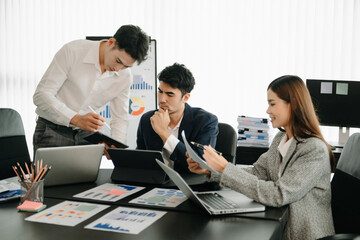 Business team discuss at meeting room. working together with laptop ,tablet and smart phone on desk Financial accountant , planner , meeting , introduction concept.