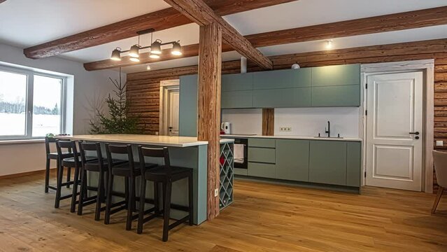 Kitchen countertop, island and dining room of a modern, rustic cabin interior - panning