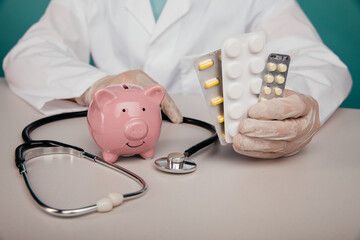 A doctor holding piggy bank and pills. Health insurance and money savings concept