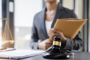 Lawyer business woman working with paperwork on his desk in office workplace for consultant lawyer in office.