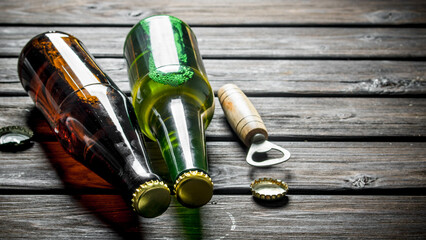 Beer in glass bottles and opener.