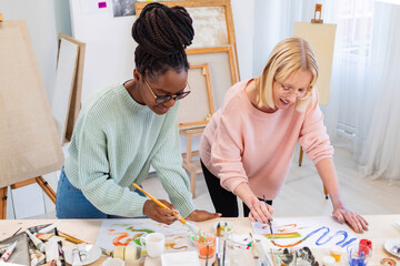 Young female artists are in their painting studio