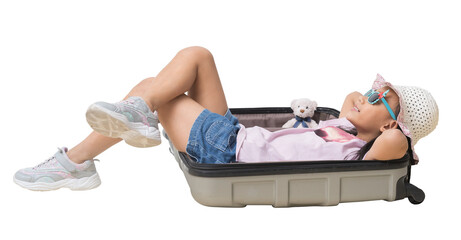 Happy kid Travel Concept, Full body Portrait of attractive cheerful girl lying in a suitcase...
