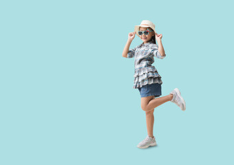 Happy kid Travel Concept, Full body Pretty asian little girl ready for vacation trip,  isolated on pastel plain light blue background