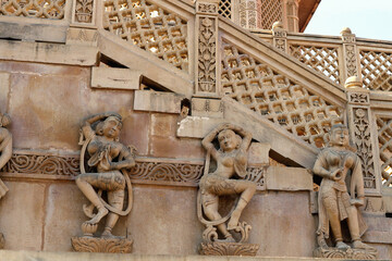 Image of various forms of the goddess Durga on the wall of a Hindu temple in India.