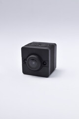 Black security camera isolated on white background. Mini spy camera