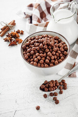 sweet crunchy chocolate children's breakfast chocolate balls on a white background