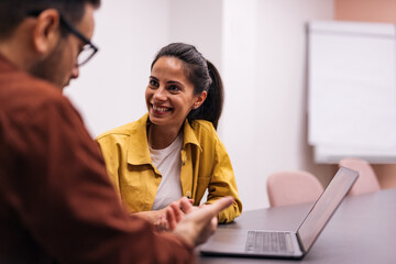 Brunette businesswoman having a conversation with each other.
