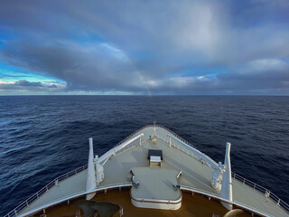 Rainbow at sea after storm during transatlantic passage on legendary ocean liner cruiseship cruise...