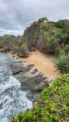 Blurred photo of beach with waves and fishing boats. Defocused beach photo during the day.