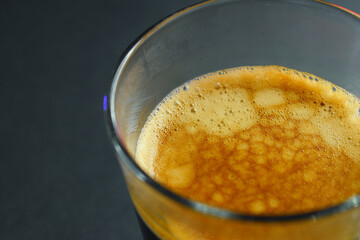 hot black coffee on black table, beverage in the morning