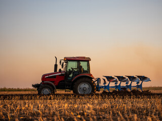 Scientific land preparation with tractor plowing and cultivating of stubble field