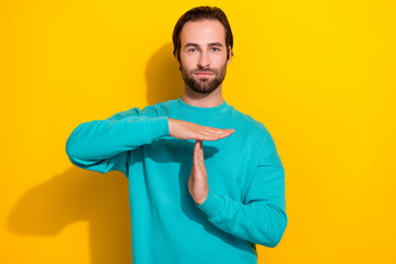 Photo of young positive brunet hair serious referee guy showing palms stop limit symbol restriction...