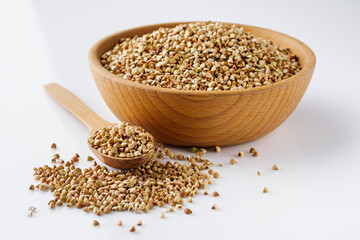 organic raw green buckwheat on a white background