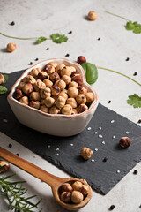 Hazelnuts in heart shaped bowl