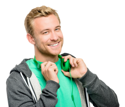 PNG of a handsome young man standing alone in the studio and posing with headphones isolated on a PNG background.
