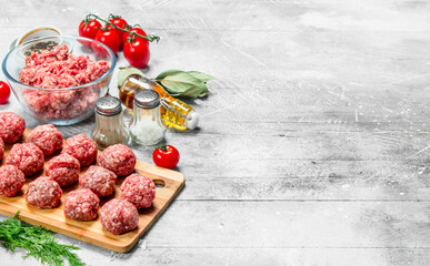 Raw beef meatballs with spices and fragrant dill .
