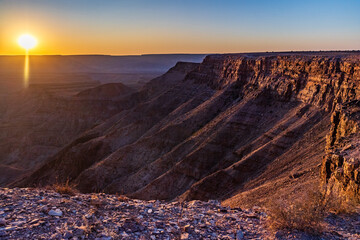 Wide angle landscape shot of the fish river canyon in Southern Namibia, around sunset.