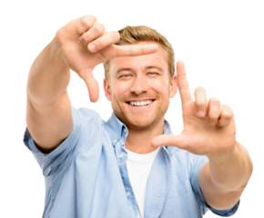 A handsome young man standing alone in the studio and using his hands to frame his face isolated on a PNG background.