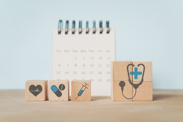 For medical healthcare, health insurance concept. medical and health icon on wooden cube block with...