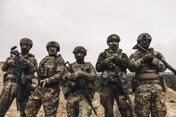 Soldiers on a shooting range looking concentrated and attentive