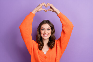 Fototapeta na wymiar Portrait of cheerful satisfied lady beaming smile fingers show heart gesture isolated on purple color background