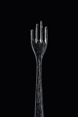 Bitten Soviet fork on a black background