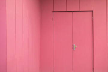 Pink interior. Door to hall. Painted walls.
