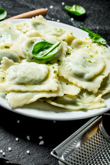 Ravioli with beef on a plate.