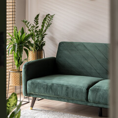 Cozy and stylish green sofa, close-up