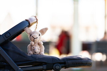 handmade crochet kangaroo pram toy and copy space