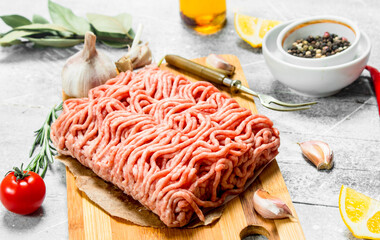 Raw minced beef with spices and herbs .