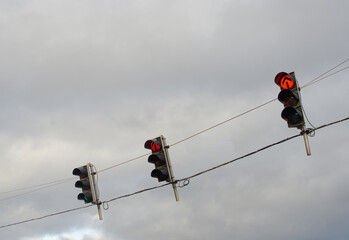 Traffic lights in red light regulating the traffic of a city. Driving school and road safety concept.