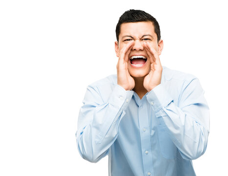 A young businessman shouting isolated on a PNG background.