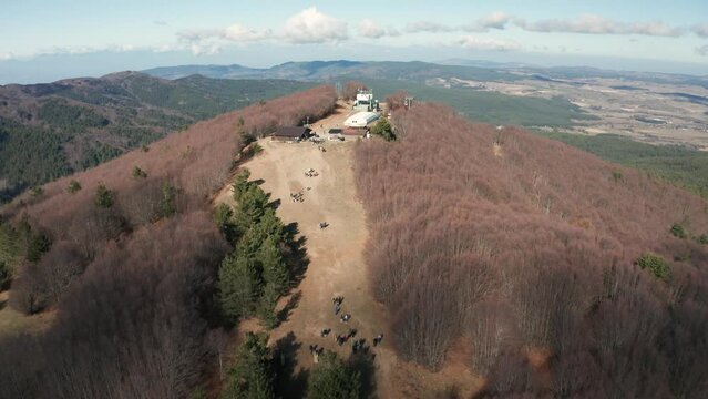 Mountain panorama with cable car and snowless challet
