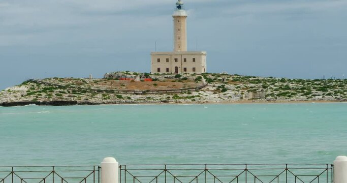 The Vieste lighthouse visible from the waterfront of Vieste, the capital of the Gargano. Apulia - Italy
