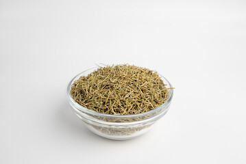 Rosemary Plant dray in a glass dish on a white background
