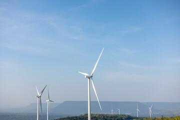 Windmill farm Generating electricity clean energy. Wind turbine farm generator by alternative green energy.
